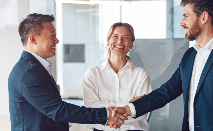 Business professionals making an introduction and shaking hands